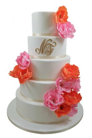 Wedding cake with bright peonies