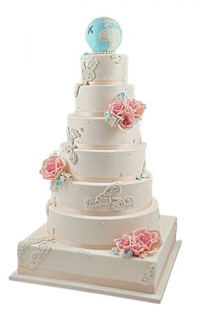 Roses and travel theme wedding cake